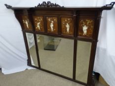 A CIRCA 1900 MAHOGANY OVERMANTEL having three bevelled edged mirrors beneath a five panel