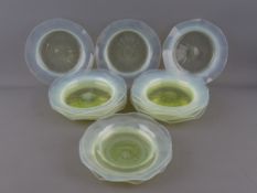 FIFTEEN VASELINE GLASS PLATES all with polished pontils, 14 and 14.5 cms diameters