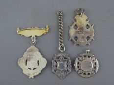 FOUR HALLMARKED SILVER PENDANT/WATCH FOBS including a Marine Lodge, no. 6619, Chester silver and