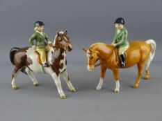 TWO BESWICK MODELS OF PONIES with green jacketed riders, 14 cms high approximately