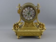 A 19th CENTURY FRENCH GILT METAL MANTEL CLOCK, gilt and enamel porcelain button dial set with