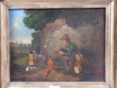 POSSIBLY ENGLISH SCHOOL oil in the manner of WILLIAM HOLMAN HUNT - seated street entertainer feeding
