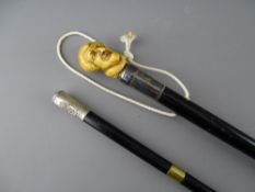 TWO EBONIZED CANES including a swagger stick type with Royal Army Medical Corps white metal top, the