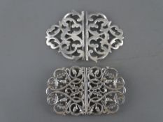 TWO SILVER NURSE'S BUCKLES, Birmingham 1900, maker Samuel M Levi and London 1991 with oak leaf and