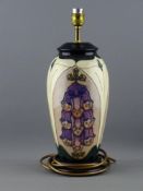 A MOORCROFT 'FOXGLOVE' TABLE LAMP BASE, designed by Rachel Bishop, 37 cms high including fitting