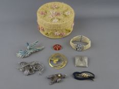 THE CONTENTS OF A LIDDED BASKET BOX including a marcasite and other brooches