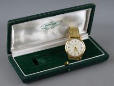 A ROLEX PRECISION NINE CARAT GOLD CASED GENT'S WRISTWATCH with expanding rolled gold bracelet strap,