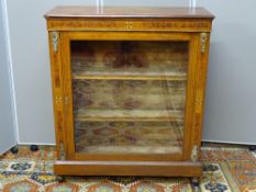 A WALNUT SINGLE GLAZED DOOR SIDE CABINET with gilt metal mounts, burr walnut and other inlays with