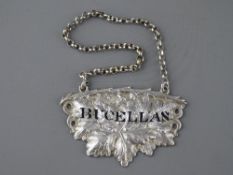 A RARE BUCELLAS SILVER DECANTER LABEL with pierced vine leaf design by George Unite, Birmingham