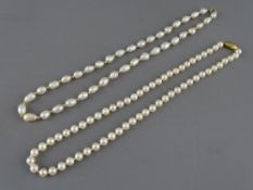 TWO SINGLE STRAND PEARL NECKLACES to include a uniform cultured pearl example with nine carat gold