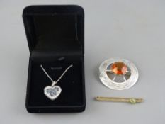 A CELTIC SILVER BROOCH, a boxed heart shaped locket and chain and a nine carat gold bar brooch