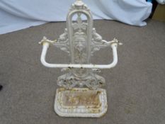A VICTORIAN CAST IRON STICKSTAND with griffin detail, base tray and date lozenge mark to the back,