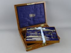 A FIGURED WALNUT & METAL MOUNTED CASED SET OF DRAWING INSTRUMENTS by Stanley, 3 Great Turnstile,
