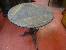 AN ANTIQUE CARVED OAK TRIPOD TABLE (ex triple flap twist top now fixed), 74.5 cms high, 69 cms