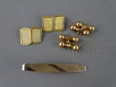TWO PAIRS OF GENT'S NINE CARAT GOLD CUFFLINKS and a base metal tie clip, one cuff set in the form of