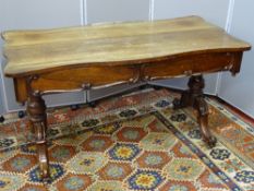 A VICTORIAN ROSEWOOD LIBRARY TABLE, the serpentine shaped top over twin frieze drawers with