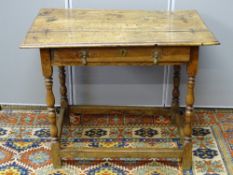 A LATE 17th CENTURY OAK SINGLE DRAWER SIDE TABLE, the three plank pegged top with moulded edge,