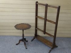 AN EARLY VICTORIAN MAHOGANY FOLDING LINEN RAIL and a piecrust top wine table with attached