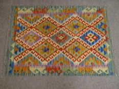 A VEGETABLE DYE WOOL CHOBI KELIM CARPET RUNNER, vibrant multi-coloured pattern with repeating