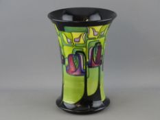 A MOORCROFT 'EMERALD ISLE' FLARED NECK VASE, designed by Emma Bossons, 21 cms high, Moorcroft