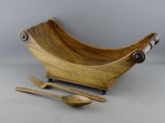 A 19th CENTURY MAHOGANY CHEESE COASTER and a pair of carved wooden servers, the coaster with