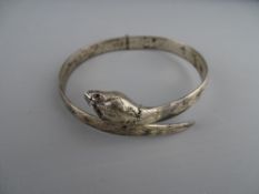 A SILVER SERPENT BANGLE, 29 grms