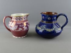 A DRAGON DECORATED PINK LUSTRE JUG and a cobalt stoneware jug by Gray & Co Ltd and Doulton Lambeth