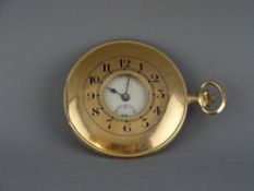 A NINE CARAT GOLD CASED HALF HUNTER KEYLESS WIND POCKET WATCH, attractively slim with silvered