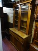 A VICTORIAN OAK & MAHOGANY SECRETAIRE BOOKCASE with carved acorn corbels, two door glass fronted top
