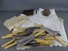 Quantity of table linen, loose collection of table knives, Ronson table lighter and an enamel