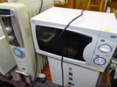 White Currys Essentials 700w microwave oven and a Monroe oil filled electric heater E/T