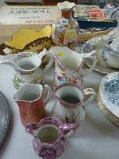 Five Victorian pottery jugs, a two handled planter and a Satsuma vase