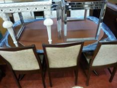 Twin pedestal dining table with six (four plus two) chairs with light floral upholstery