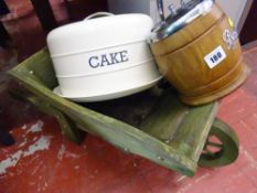 Small wooden garden wheelbarrow, metal cake tin and wooden biscuit barrel