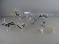Collection of glass figurines and various dolphins all having lustre effect finishes