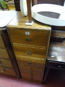 Pair of three drawer bedside cabinets and a vintage white circular dressing mirror