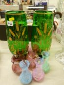 Collection of colourful glass vases including three Caithness examples