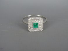 Presumed white gold square cut emerald and diamond cluster ring, 3.3 grms gross