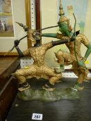 Pair of historical ancient warriors at battle metallic figurines on a plinth