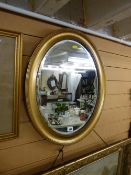 Gilt framed oval bevelled edge wall mirror
