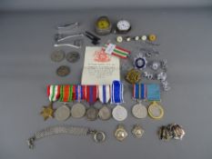 World War II unmarked group of three Elizabeth Coronation and Jubilee medals and an exemplary police