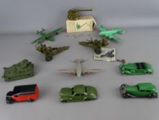 Seven Dinky diecast vehicles and planes, a Meccano example, two Howitzers, unknown maker and a W