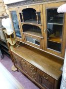 Quality medium oak sideboard with twin glazed door upper section and central drop down section