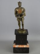 Unattributed bronze statue of a knight/king in crusader armour on a black and pink marble base