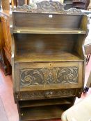 Carved bureau bookcase with mask drawer detail