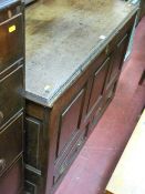Antique oak mule chest with lift-up lid, three panel front section and twin drawers