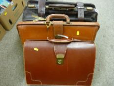 Vintage leather and brass holdall and two briefcases