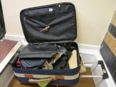 Modern suitcase with quantity of lady's handbags etc