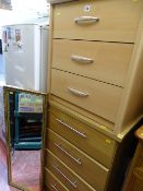 Two non-matching melamine bedroom chests and a gilt framed wall mirror