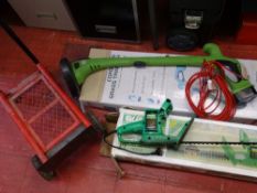 Boxed Qualcast hedge cutter, a small garden trolley and a cordless grass trimmer (boxed) E/T